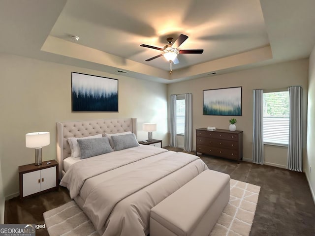 118 Garrett Dr, Eatonton, GA 31024 - bedroom with a raised ceiling, baseboards, a ceiling fan, and carpet floors