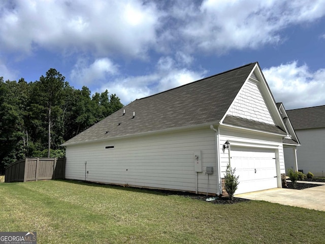 118 Garrett Dr, Eatonton, GA 31024 - view of home's exterior featuring roof with shingles and concrete driveway
