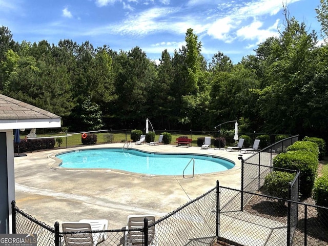 118 Garrett Dr, Eatonton, GA 31024 - community pool featuring a patio and fence