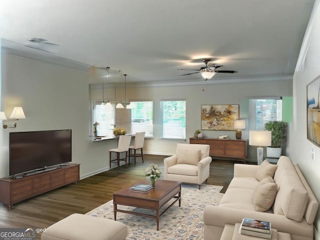 118 Garrett Dr, Eatonton, GA 31024 - living room with ornamental molding, wood finished floors, healthy amount of natural light, a ceiling fan, and baseboards