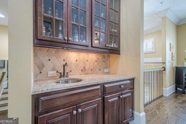 2295 Falmouth Ct SE Unit 23, Smyrna, GA 30080 - indoor wet bar with ornamental molding, dark wood-style flooring, and decorative backsplash