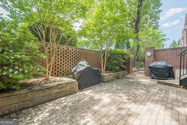 2295 Falmouth Ct SE Unit 23, Smyrna, GA 30080 - view of patio / terrace featuring a grill and a gate