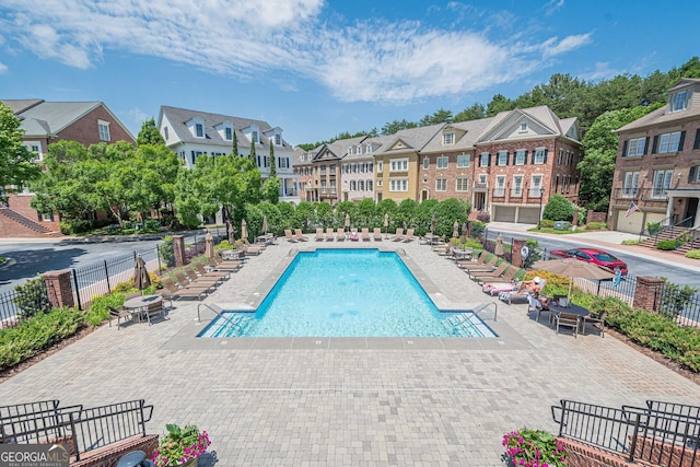 2295 Falmouth Ct SE Unit 23, Smyrna, GA 30080 - community pool with a residential view and a patio area