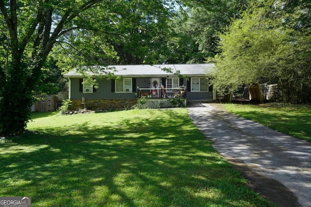 377 Black Oak Ct, Lawrenceville, GA 30046 - ranch-style house with driveway, a front yard, and covered porch