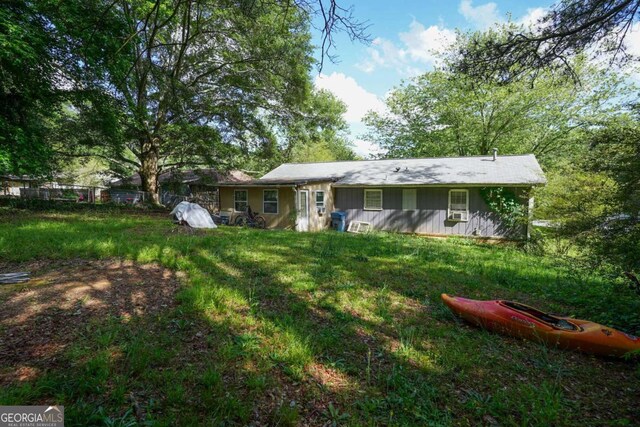 377 Black Oak Ct, Lawrenceville, GA 30046 - back of house with fence and board and batten siding