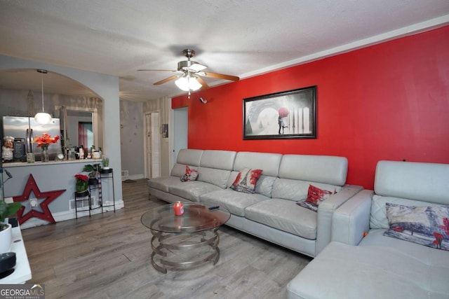 377 Black Oak Ct, Lawrenceville, GA 30046 - living room featuring wood finished floors, ceiling fan, and baseboards
