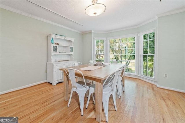 1763 Benningfield Dr SW, Marietta, GA 30064 - dining space featuring light wood-style floors, baseboards, and ornamental molding