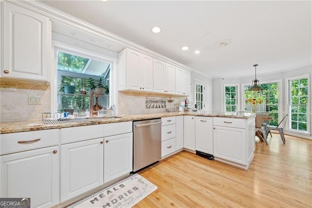 1763 Benningfield Dr SW, Marietta, GA 30064 - kitchen with stainless steel dishwasher, light wood-type flooring, white cabinetry, decorative backsplash, and recessed lighting