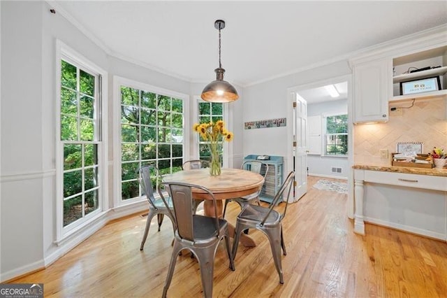 1763 Benningfield Dr SW, Marietta, GA 30064 - dining area with light wood-style flooring, ornamental molding, and baseboards