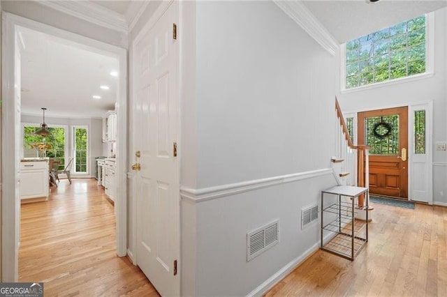 1763 Benningfield Dr SW, Marietta, GA 30064 - foyer featuring light wood-style flooring, crown molding, stairs, and recessed lighting