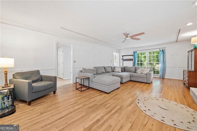 1763 Benningfield Dr SW, Marietta, GA 30064 - living room with wood finished floors, ceiling fan, and ornamental molding