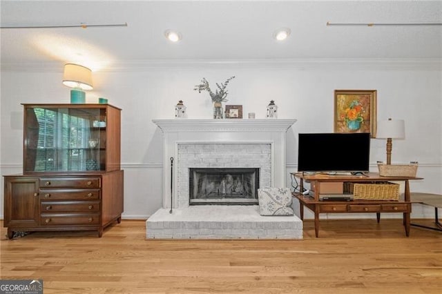 1763 Benningfield Dr SW, Marietta, GA 30064 - living room with crown molding, wood finished floors, and a brick fireplace