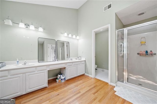 1763 Benningfield Dr SW, Marietta, GA 30064 - full bath featuring double vanity, a stall shower, and toilet