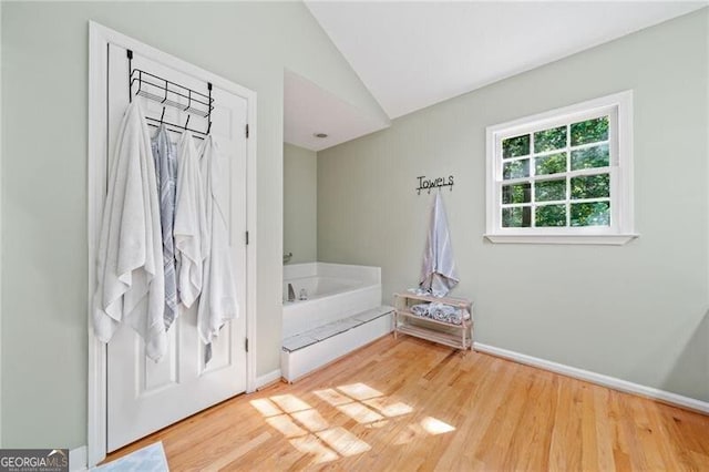 1763 Benningfield Dr SW, Marietta, GA 30064 - bedroom with wood finished floors, vaulted ceiling, and baseboards