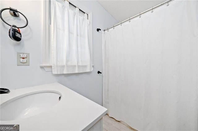1763 Benningfield Dr SW, Marietta, GA 30064 - bathroom featuring a sink and curtained shower