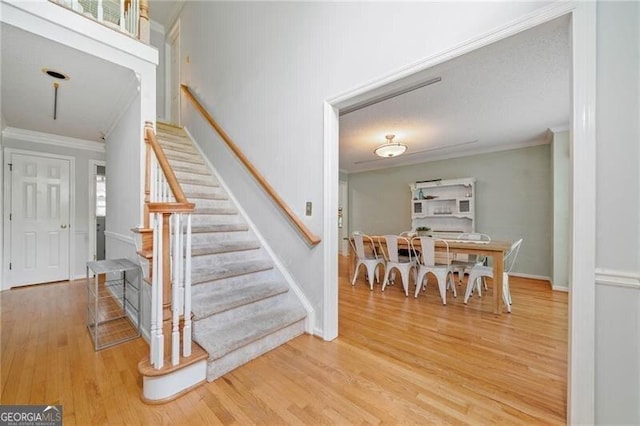 1763 Benningfield Dr SW, Marietta, GA 30064 - stairs with crown molding, wood finished floors, and baseboards