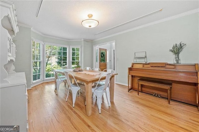 1763 Benningfield Dr SW, Marietta, GA 30064 - dining room with light wood-style flooring, ornamental molding, and baseboards