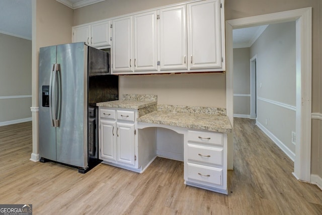 kitchen featuring stainless steel refrigerator with ice dispenser, ornamental molding, light wood-style flooring, and white cabinetry