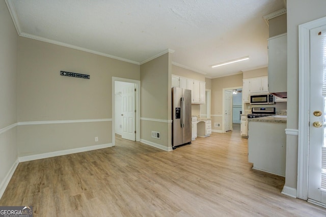 kitchen featuring stainless steel appliances, white cabinetry, light wood-style floors, light countertops, and baseboards
