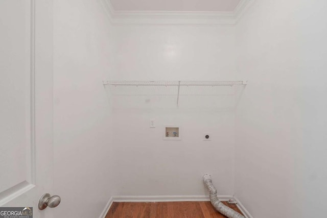 laundry room with electric dryer hookup, ornamental molding, hookup for a washing machine, wood finished floors, and baseboards