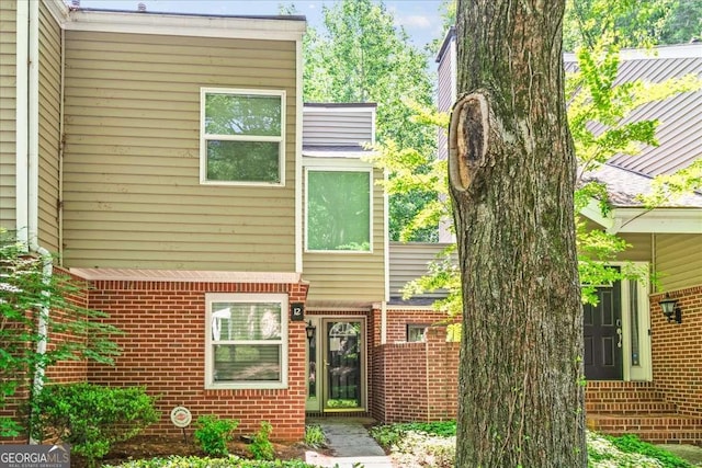 view of front of home with brick siding