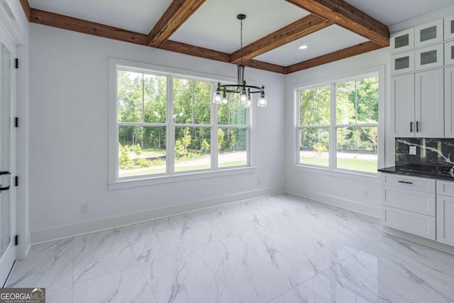 140 Maranatha Trl, Lawrenceville, GA 30045 - unfurnished dining area featuring baseboards, a chandelier, beam ceiling, and light marble finish floors