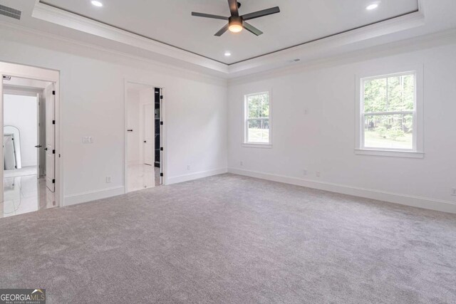 140 Maranatha Trl, Lawrenceville, GA 30045 - empty room featuring a raised ceiling, crown molding, ceiling fan, recessed lighting, and carpet