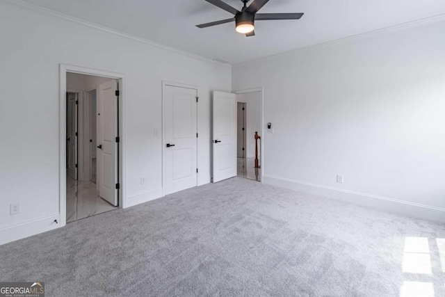 140 Maranatha Trl, Lawrenceville, GA 30045 - unfurnished bedroom with ornamental molding, carpet flooring, baseboards, connected bathroom, and ceiling fan
