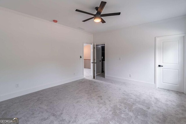 140 Maranatha Trl, Lawrenceville, GA 30045 - carpeted empty room with ceiling fan, ornamental molding, and baseboards