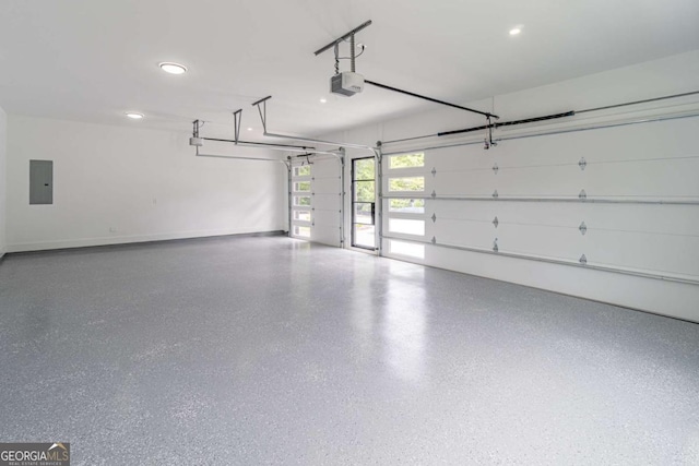 140 Maranatha Trl, Lawrenceville, GA 30045 - garage with electric panel, a garage door opener, recessed lighting, and baseboards