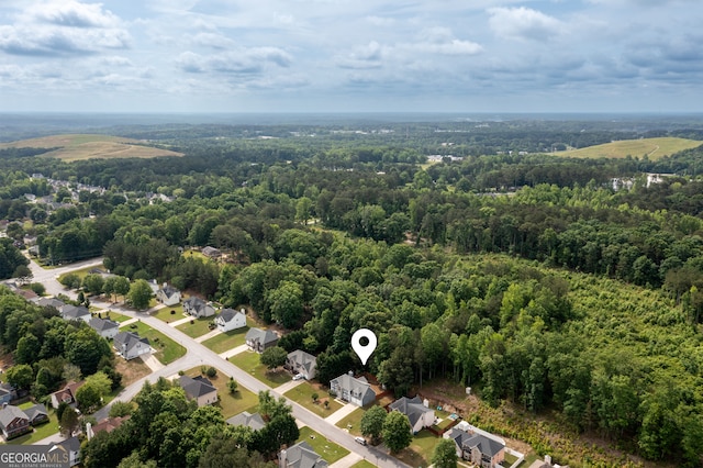 aerial view of residential area with a forest