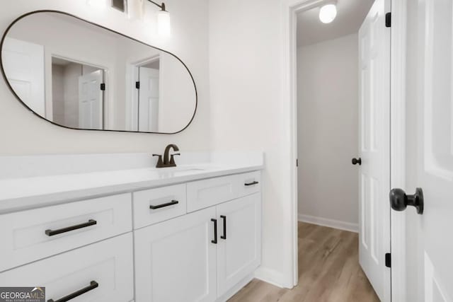683 Highland Ct, Marietta, GA 30068 - bathroom with wood finished floors, vanity, and baseboards