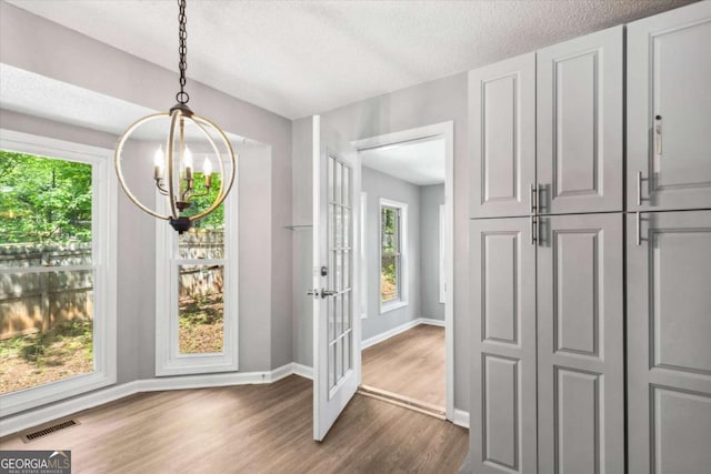 191 Nectar Pl, Dallas, GA 30132 - entryway featuring a chandelier, dark wood finished floors, baseboards, french doors, and a textured ceiling