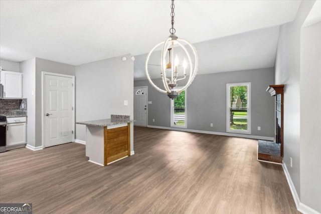 191 Nectar Pl, Dallas, GA 30132 - kitchen featuring a chandelier, wood finished floors, white cabinets, and baseboards
