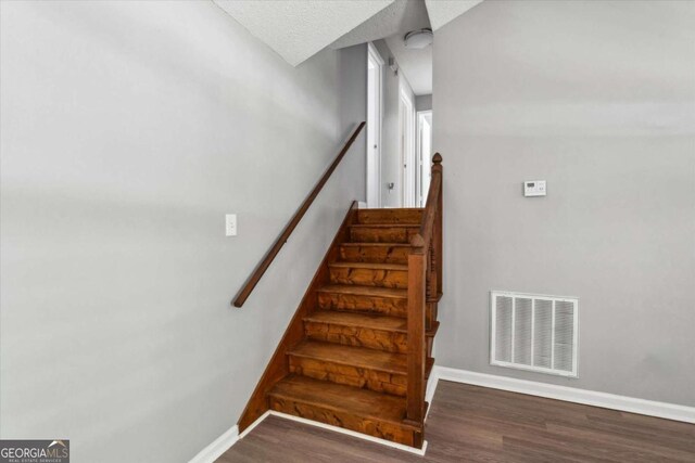 191 Nectar Pl, Dallas, GA 30132 - stairs featuring wood finished floors, baseboards, and a textured ceiling
