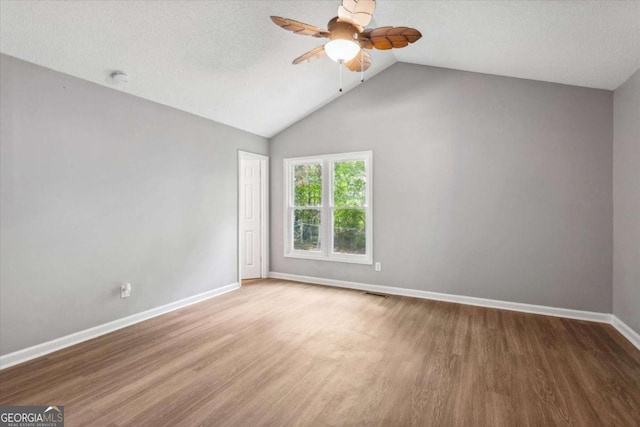 191 Nectar Pl, Dallas, GA 30132 - spare room with a ceiling fan, wood finished floors, baseboards, and lofted ceiling