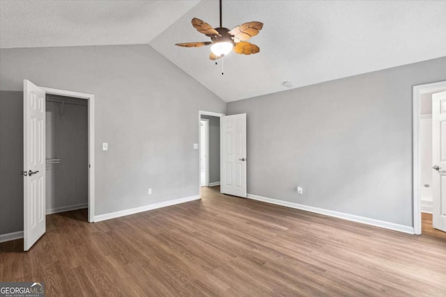 191 Nectar Pl, Dallas, GA 30132 - unfurnished bedroom with vaulted ceiling, wood finished floors, baseboards, ceiling fan, and ensuite bath