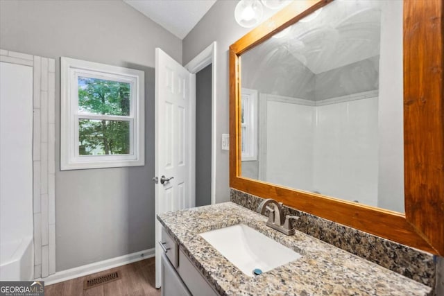 191 Nectar Pl, Dallas, GA 30132 - full bath with wood finished floors, vanity, baseboards, and a bathtub