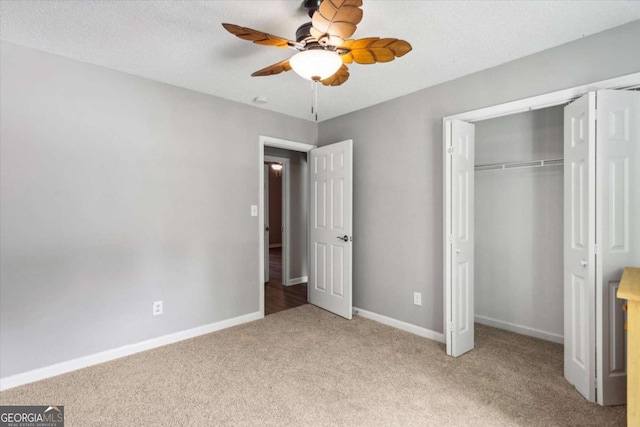 191 Nectar Pl, Dallas, GA 30132 - unfurnished bedroom with light carpet, a closet, baseboards, and ceiling fan