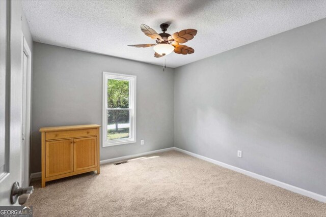 191 Nectar Pl, Dallas, GA 30132 - empty room featuring a ceiling fan, light colored carpet, baseboards, and a textured ceiling