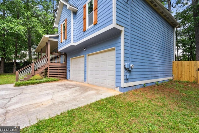 191 Nectar Pl, Dallas, GA 30132 - view of side of home featuring an attached garage, fence, stairway, and driveway