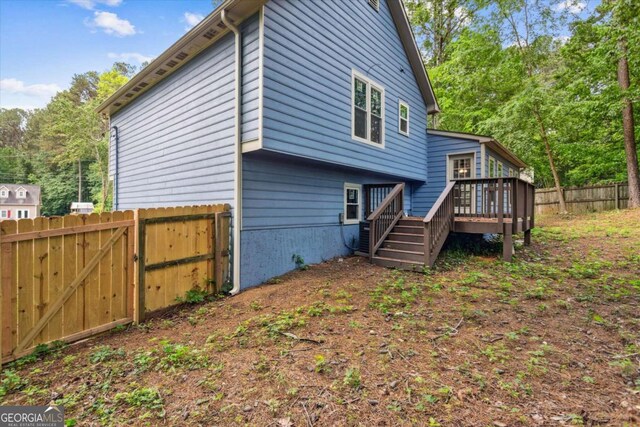 191 Nectar Pl, Dallas, GA 30132 - rear view of property with a wooden deck, fence, and a gate