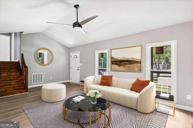 191 Nectar Pl, Dallas, GA 30132 - living area featuring ceiling fan, plenty of natural light, wood finished floors, and vaulted ceiling
