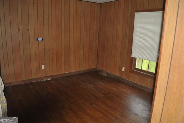 701 Fletcher St, Cedartown, GA 30125 - spare room with dark wood-type flooring and wooden walls
