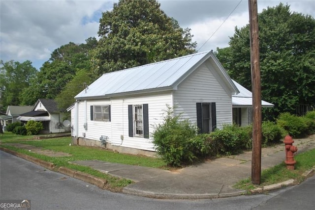 701 Fletcher St, Cedartown, GA 30125 - view of side of property featuring metal roof