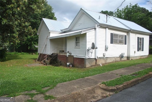 701 Fletcher St, Cedartown, GA 30125 - view of front facade featuring a front yard, metal roof, and a porch