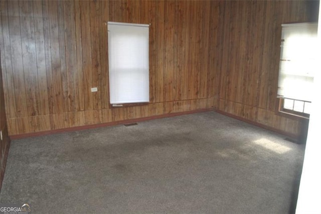 701 Fletcher St, Cedartown, GA 30125 - carpeted empty room featuring wooden walls
