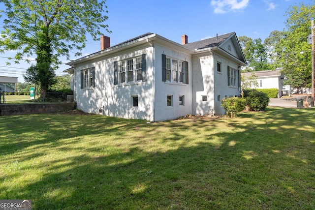 back of property featuring a chimney