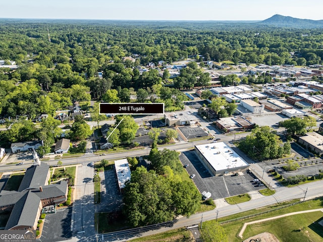 aerial view of property's location with a forest