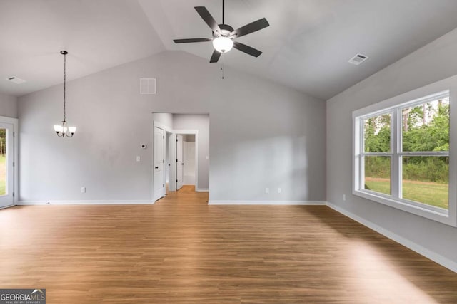 0 Grogan Rd, Buchanan, GA 30113 - unfurnished living room featuring a chandelier, a ceiling fan, light wood-style floors, baseboards, and high vaulted ceiling